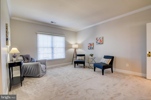 sitting room with visible vents, carpet flooring, crown molding, and baseboards