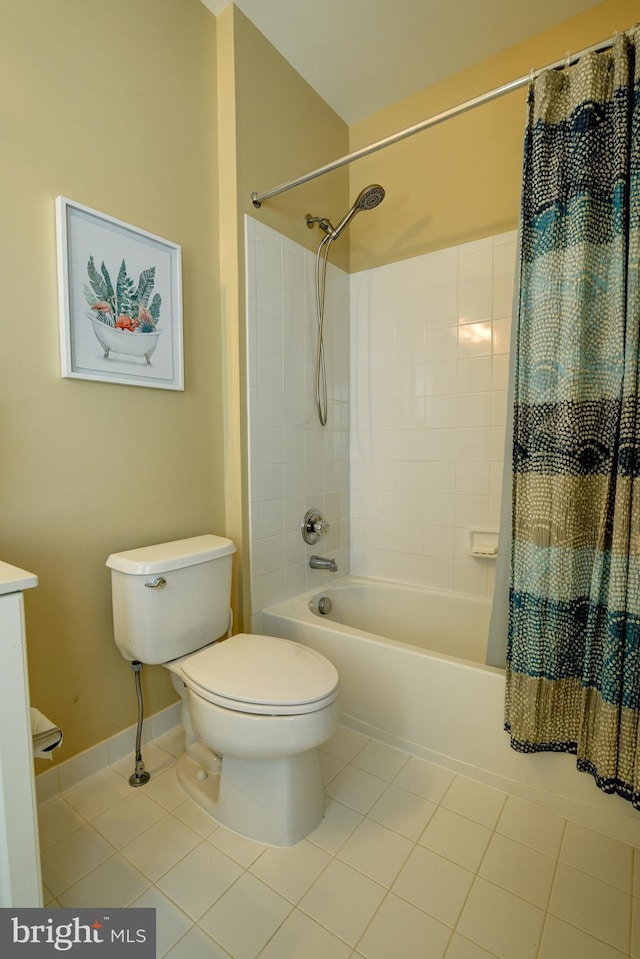 bathroom featuring tile patterned floors, baseboards, toilet, and shower / bath combination with curtain