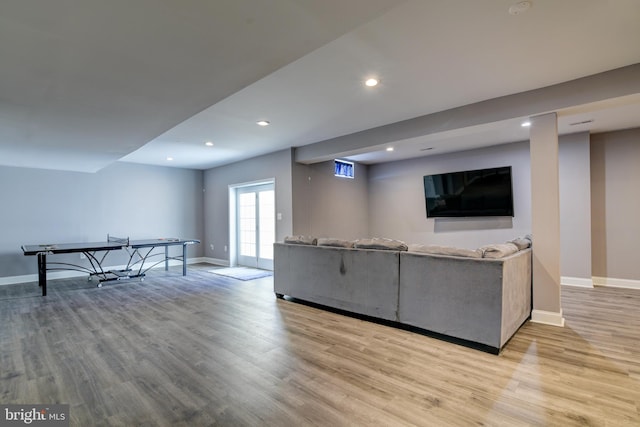 living area featuring recessed lighting, wood finished floors, and baseboards