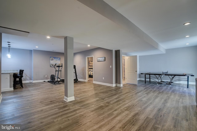 exercise room featuring recessed lighting, baseboards, and wood finished floors