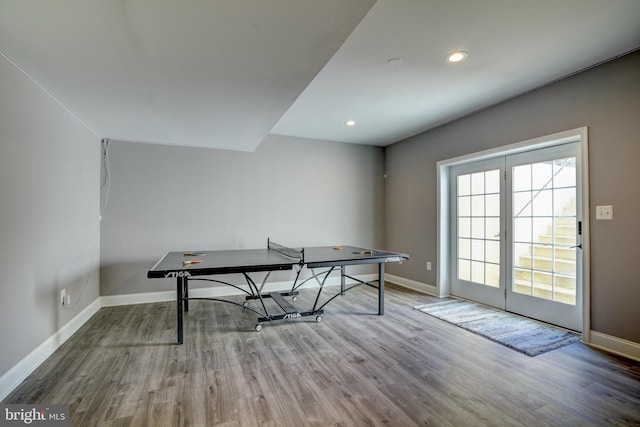 recreation room with recessed lighting, baseboards, and wood finished floors