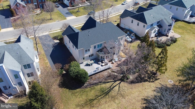 birds eye view of property with a residential view