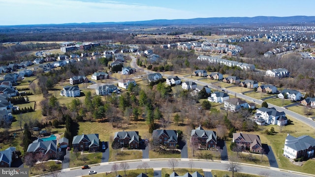 drone / aerial view with a residential view and a mountain view