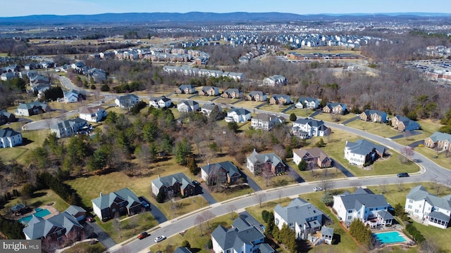 birds eye view of property with a residential view