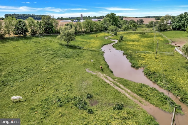 aerial view featuring a rural view and a water view