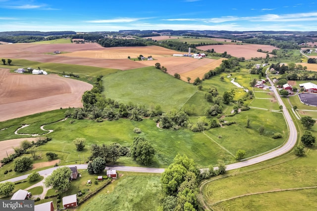 birds eye view of property with a rural view