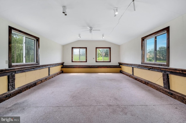 additional living space with plenty of natural light, ceiling fan, and vaulted ceiling