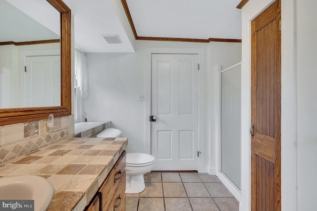 bathroom with tile patterned floors, crown molding, toilet, a shower with door, and vanity