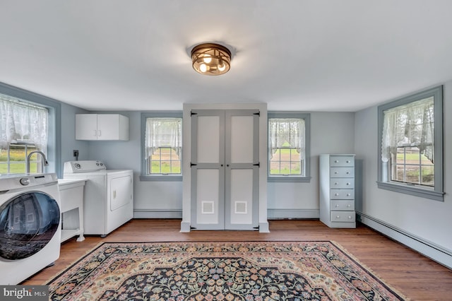 laundry room featuring cabinets and a wealth of natural light