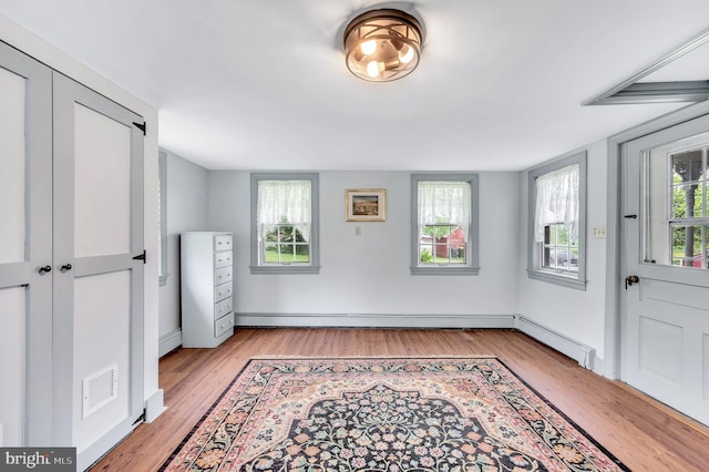 bedroom featuring light hardwood / wood-style flooring and a closet