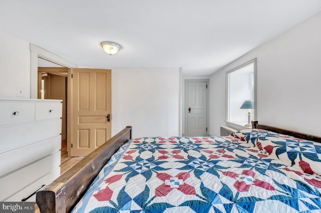 bedroom with light hardwood / wood-style flooring