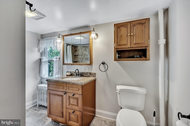 bathroom with radiator, vanity, a shower with shower curtain, and toilet