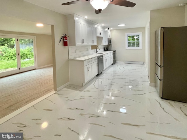 kitchen with white cabinetry, plenty of natural light, sink, and appliances with stainless steel finishes