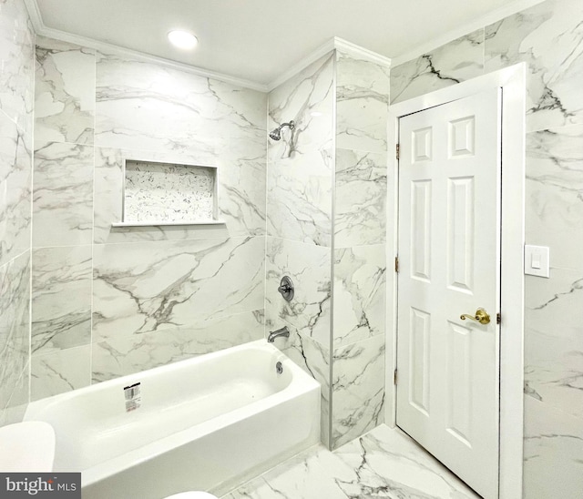 bathroom with tiled shower / bath combo, toilet, and crown molding