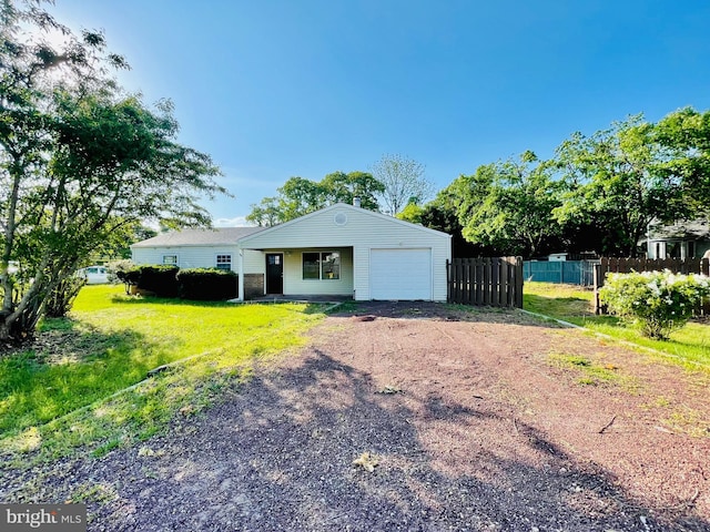 view of front facade with a front yard and a garage