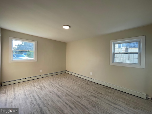 spare room featuring hardwood / wood-style flooring