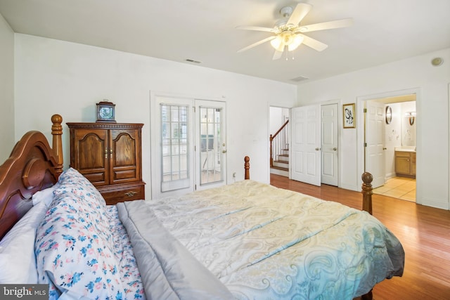 bedroom featuring ceiling fan, access to exterior, light wood-type flooring, and ensuite bath