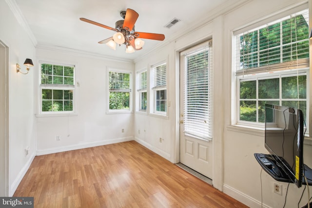 interior space with ceiling fan and a wealth of natural light