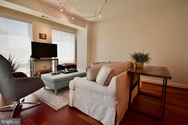 living room with track lighting and hardwood / wood-style floors