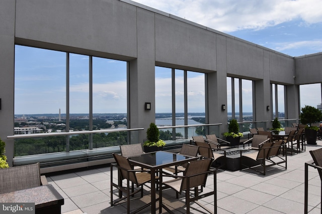 exterior space with a wealth of natural light and a water view