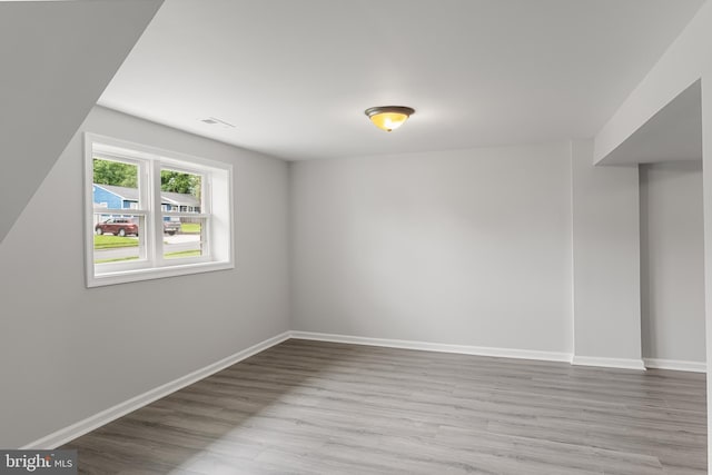 unfurnished room featuring light hardwood / wood-style floors