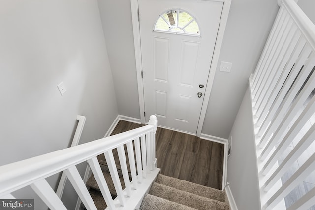 stairs with wood-type flooring