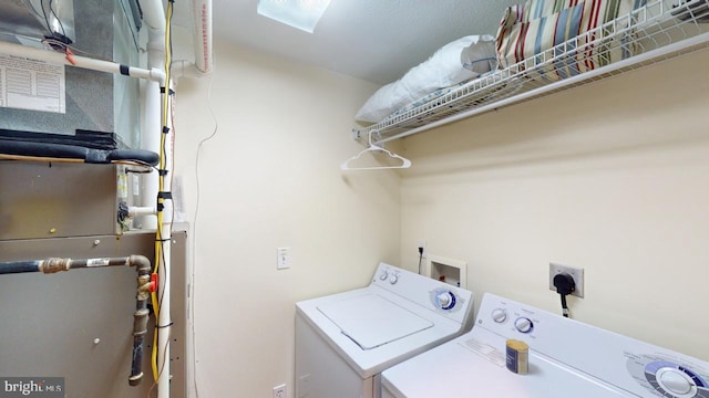 laundry area with washing machine and clothes dryer