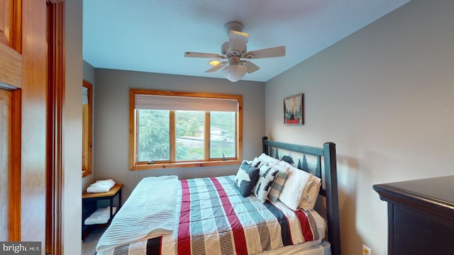 bedroom with ceiling fan and lofted ceiling