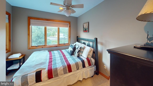 carpeted bedroom featuring ceiling fan and lofted ceiling