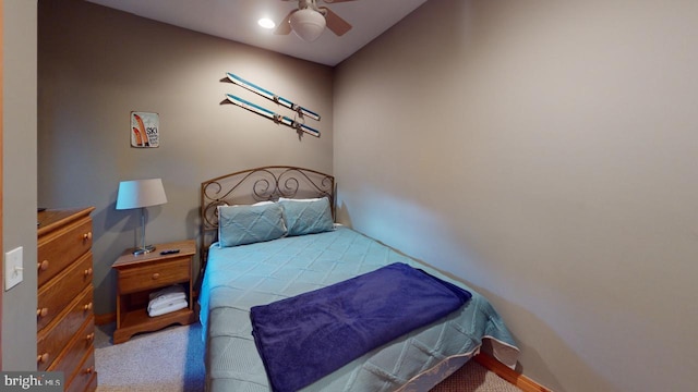 bedroom with light colored carpet and ceiling fan