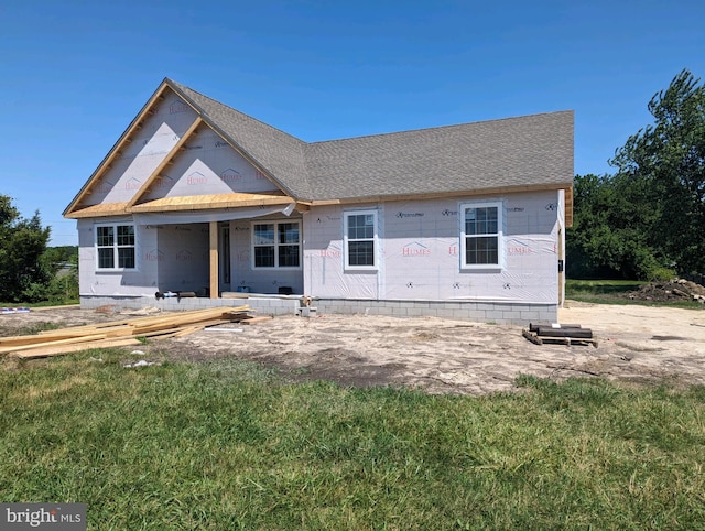 unfinished property with a front lawn