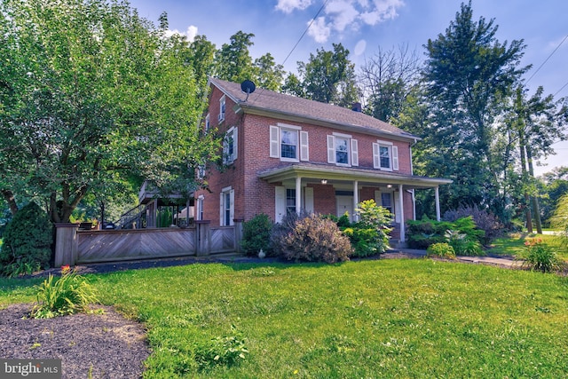 colonial home with a front yard