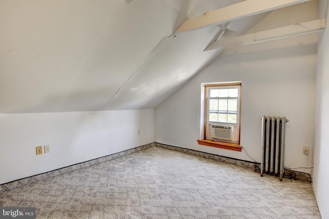 additional living space with lofted ceiling with beams, cooling unit, light colored carpet, and radiator