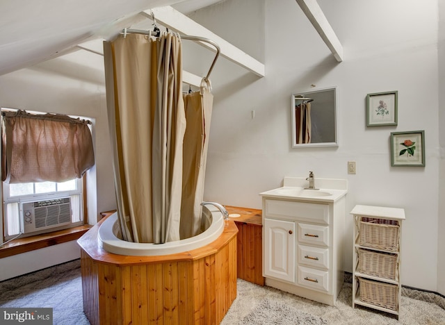 bathroom with a bath and vanity