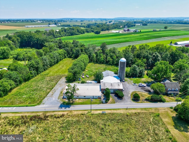 birds eye view of property with a rural view