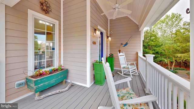 wooden terrace featuring ceiling fan