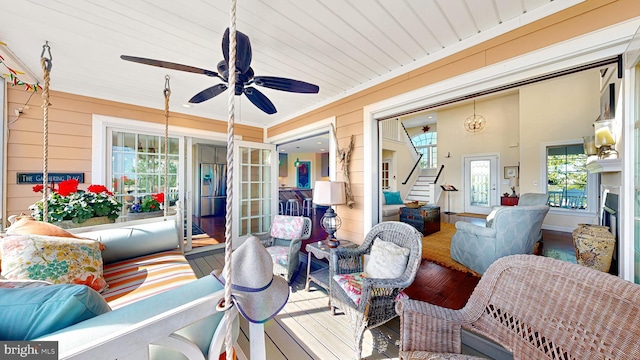 interior space featuring ceiling fan and a fireplace