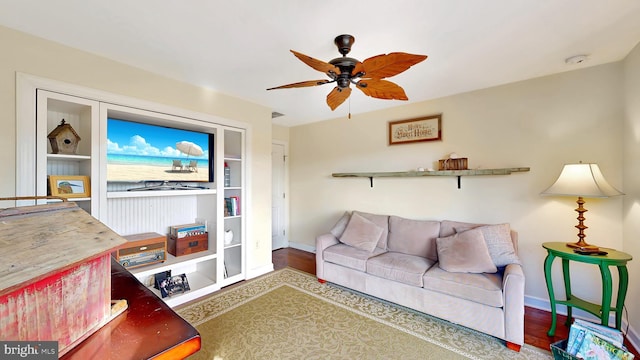 living room with hardwood / wood-style floors and ceiling fan