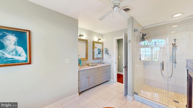 bathroom featuring tile patterned flooring, vanity, a shower with door, and ceiling fan