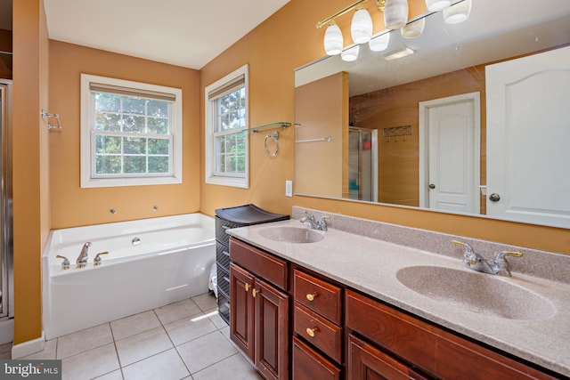 bathroom featuring tile patterned floors, vanity, and shower with separate bathtub