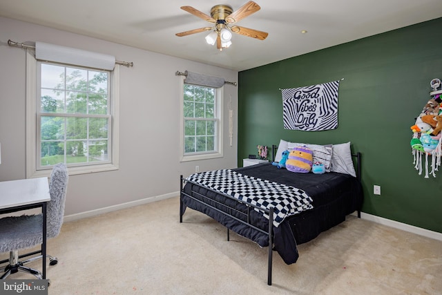 bedroom featuring ceiling fan and light colored carpet