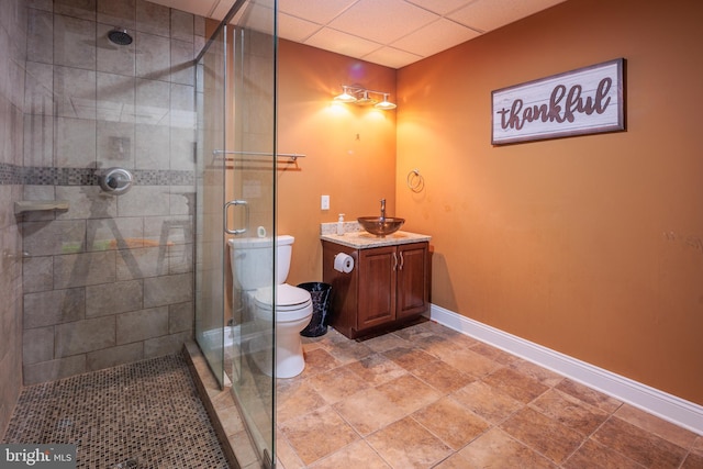 bathroom with vanity, toilet, and an enclosed shower