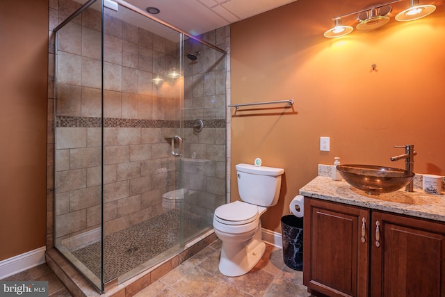 bathroom featuring vanity, toilet, and an enclosed shower