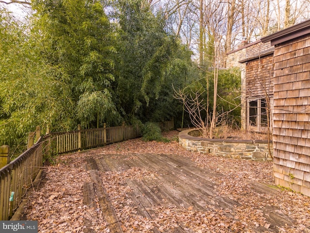 view of yard with a wooden deck