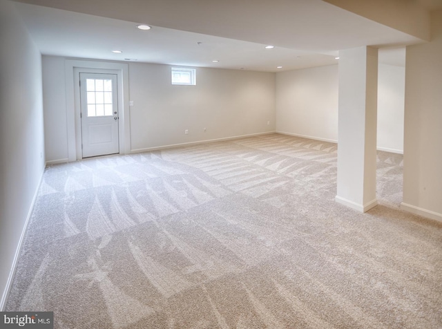 basement with light colored carpet