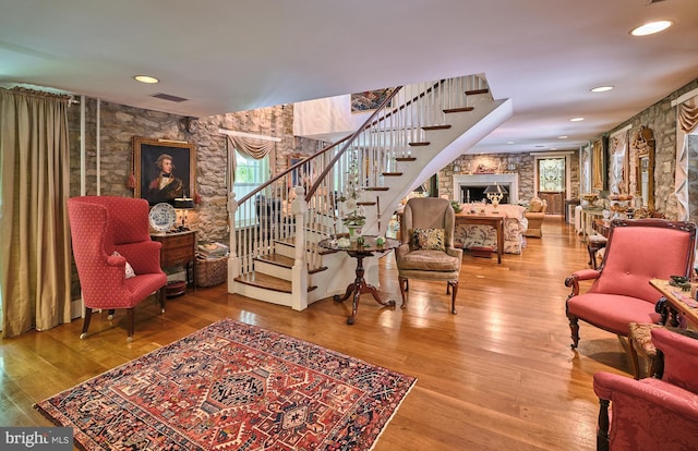 stairway featuring wood-type flooring