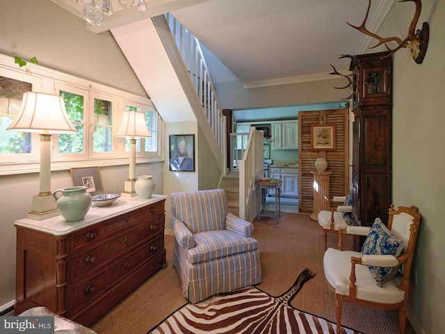 living area featuring light carpet, ornamental molding, and a baseboard heating unit