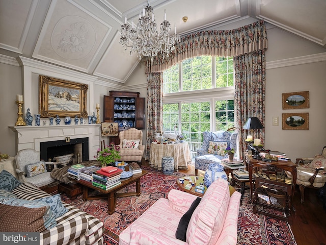 living room featuring hardwood / wood-style floors, ornamental molding, an inviting chandelier, and vaulted ceiling