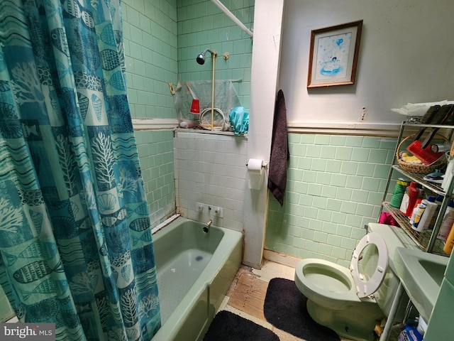 bathroom with toilet, shower / bath combination with curtain, tile walls, and hardwood / wood-style flooring