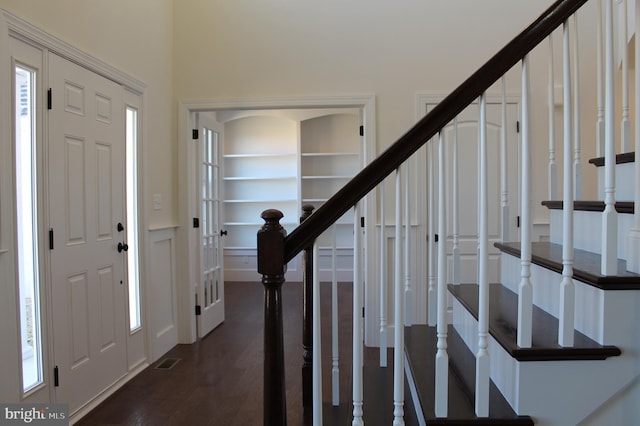 entrance foyer with dark hardwood / wood-style flooring